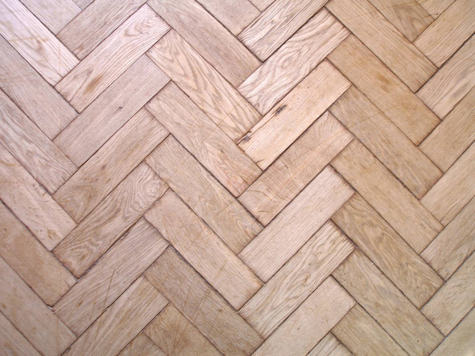 Before and after comparison of a renovated hallway with luxury vinyl flooring